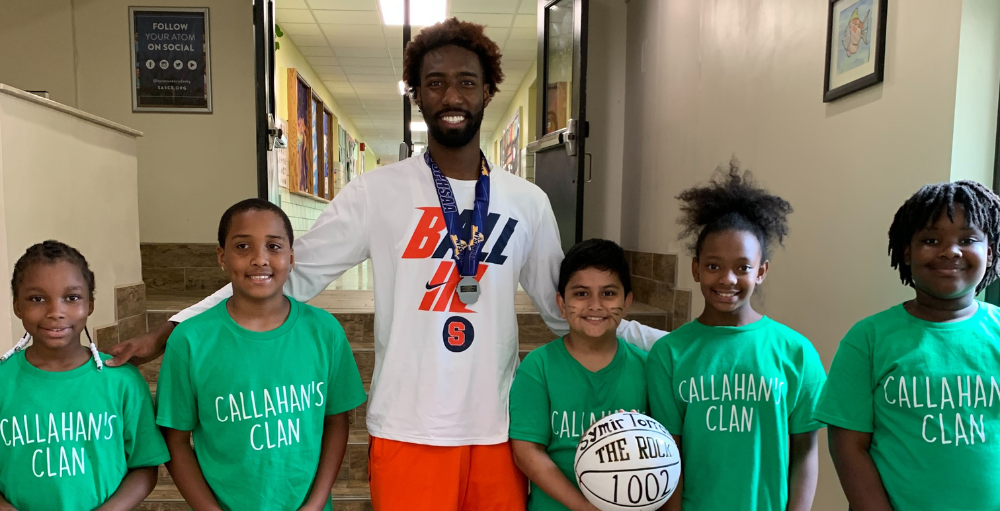 Syracuse University basketball guard, Symir Torrence visited his alma mater, Syracuse Academy of Science Charter Schools and posed for pictures with the Atoms.
