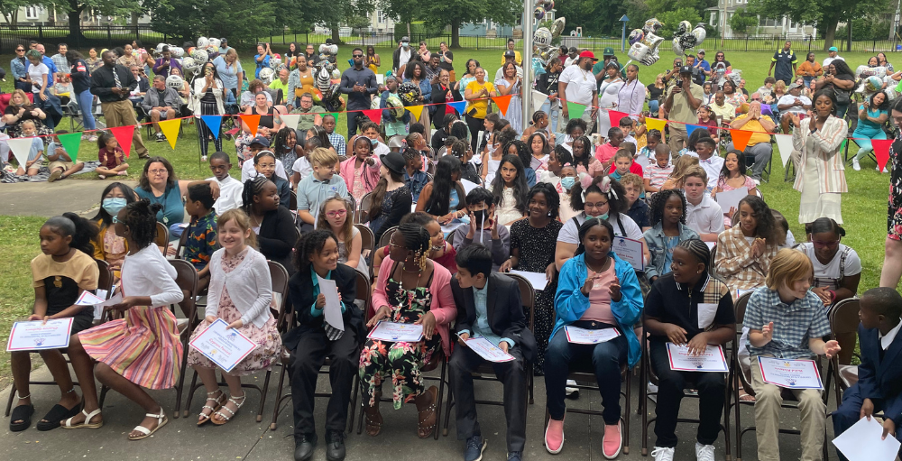 Syracuse Academy of Science elementary school’s 4th-grade students celebrate their last day of elementary school at their Moving Up Ceremony.