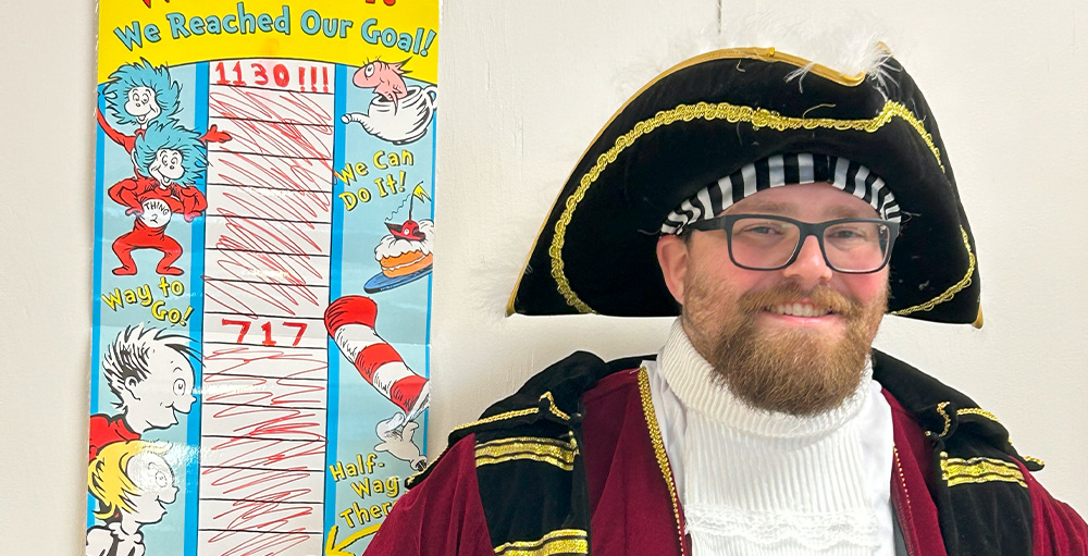 Syracuse Academy of Science Middle School Teacher Dresses Like Pirate to Celebrate Reading Challenge Milestone