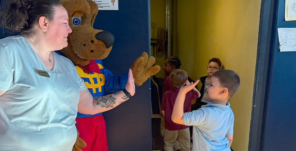 Syracuse Academy of Science Welcomes Empower Federal Credit Union for Annual Dollar Dog Assembly